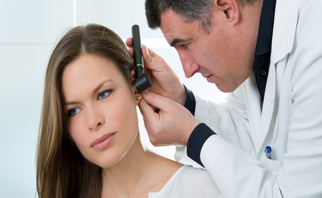 ENT doctor working with patient